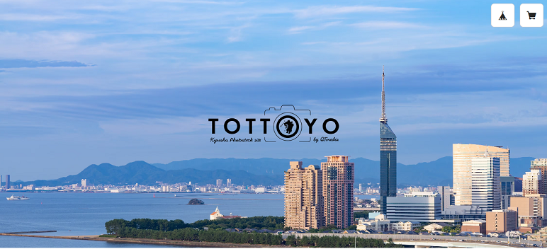 画像：福岡の百道浜風景写真にTOTTOYOロゴを配置したトップページのスクリーンショット